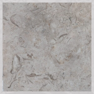 Polished Catrina Egyptian marble tile flooring in a modern hotel lobby, showing the warm beige color and subtle brown veining